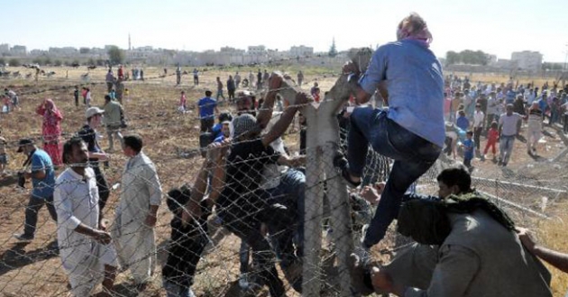 Sınırda telleri yıkıp Suriye`ye geçtiler