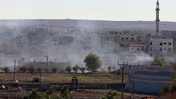 Kobani`de çatışmalar sınır kapısı yakınında şiddetlendi Terör örgütü IŞİD ile bazı Kürt gruplar arasında Halep`e bağlı