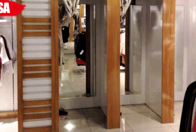 Mağazadaki kıyafetlerin alarmlarını sökerken yakalandı