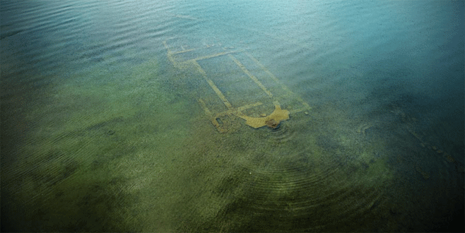 Göl dibindeki bazilikadan sikkeler ve altın küpe çıktı