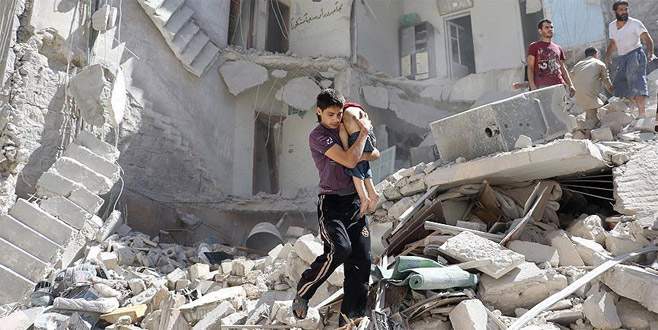 ‘Halep’te saldırı altındaki binada 100’den fazla çocuk mahsur’