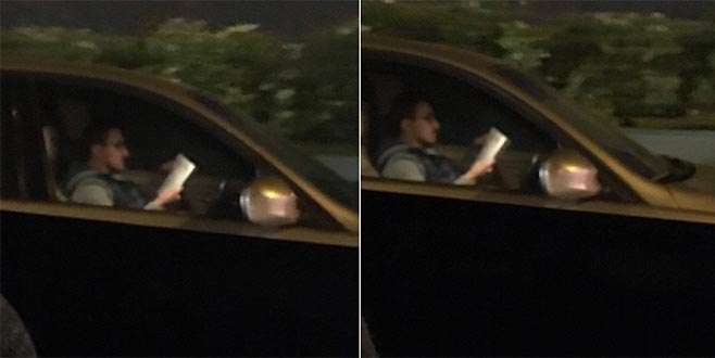 Trafikte hem araç kullandı hem de kitap okudu