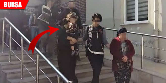 Uyuşturucu taciri, kucağındaki bebeğiyle adliyeye sevk edildi