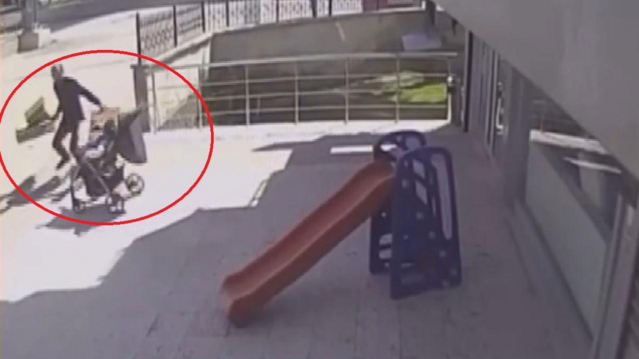 Bebek arabasını yola düşmekten son anda kurtardı