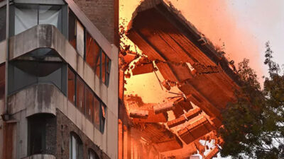 Alevlerin sardığı binanın duvarı bir anda yıkıldı