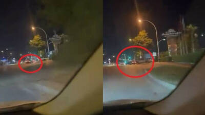 Bursa’da yeşil ışıkta drift yaparak kalkan otomobil, park halindeki araçlara